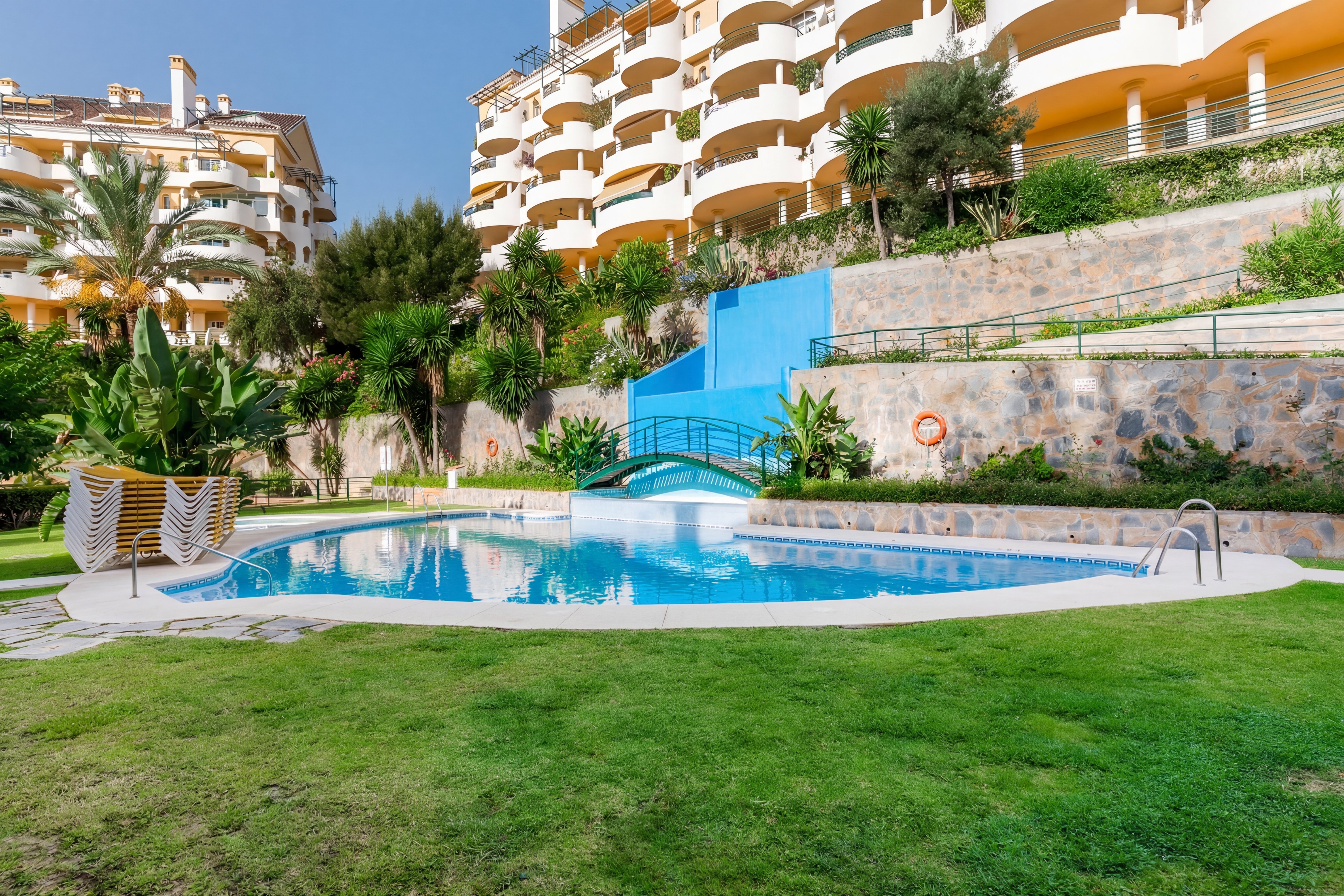 Señorío de Aloha main pool with gardens and buildings