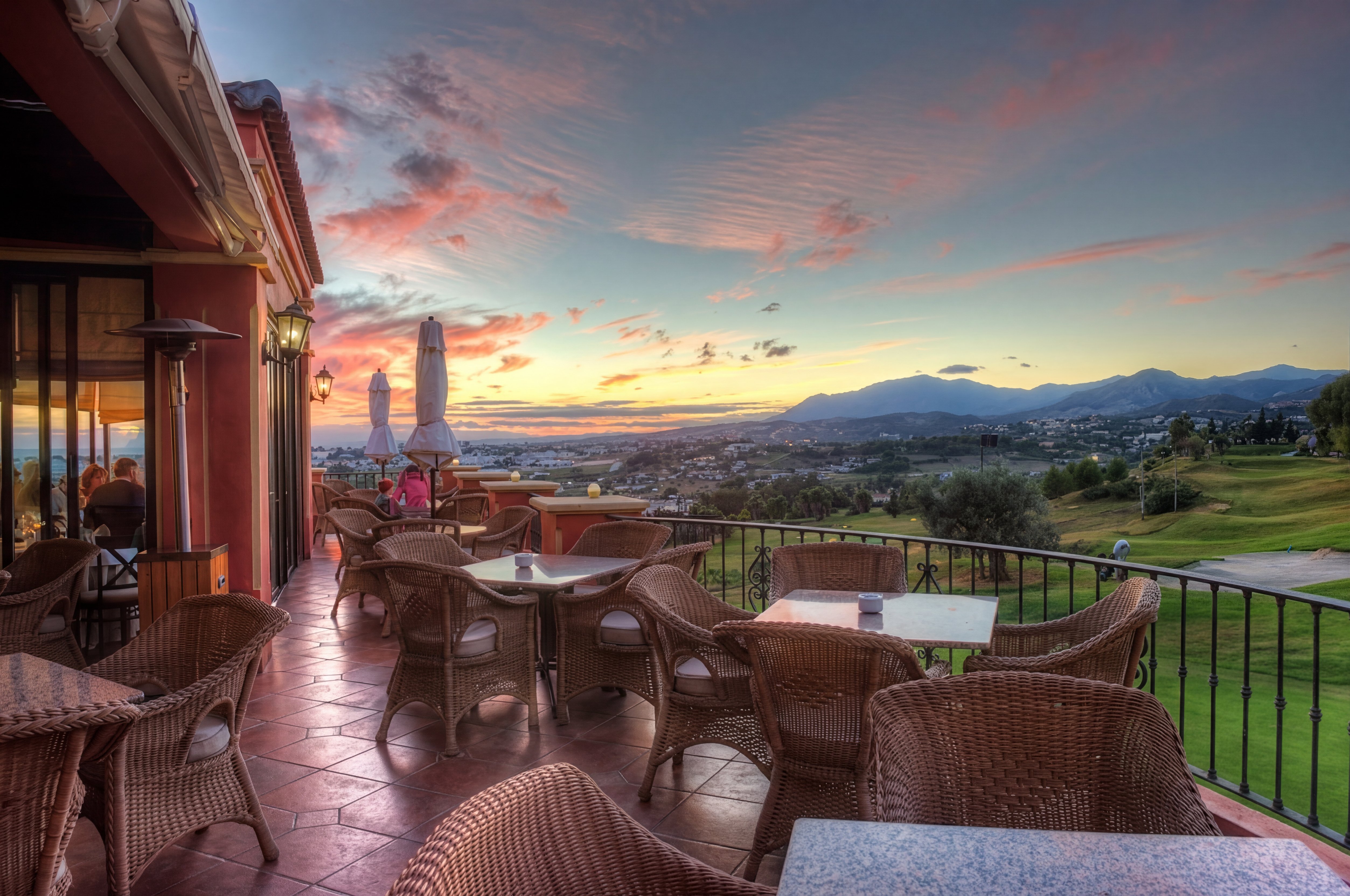 Magna Café terrace at sunset overlooking the golf valley