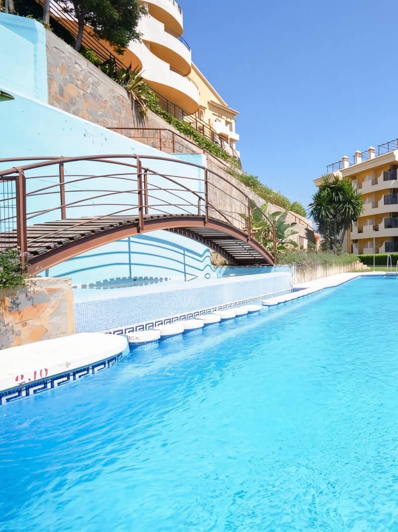 Señorío de Aloha arched footbridge over the main pool